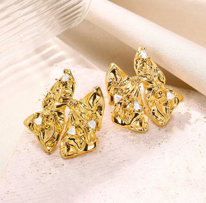 BOW EARRINGS ‎